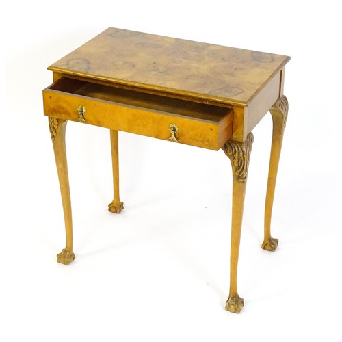 1501 - A 20thC Queen Anne style side table with a burr walnut veneered top above a single long drawer raise... 