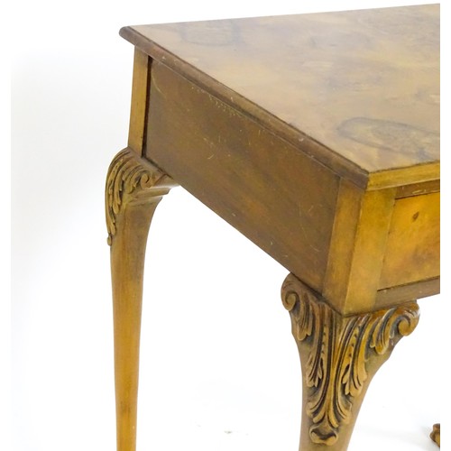 1501 - A 20thC Queen Anne style side table with a burr walnut veneered top above a single long drawer raise... 