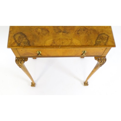 1501 - A 20thC Queen Anne style side table with a burr walnut veneered top above a single long drawer raise... 