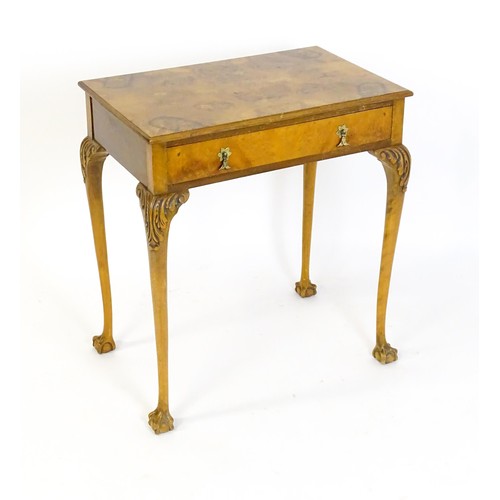 1501 - A 20thC Queen Anne style side table with a burr walnut veneered top above a single long drawer raise... 