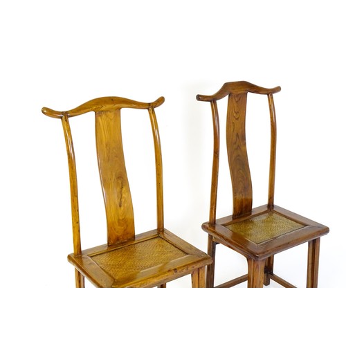 1518 - Two 19thC Chinese elm yoke back chairs, with shaped top rails, bowed mid rails and a rushed seat abo... 