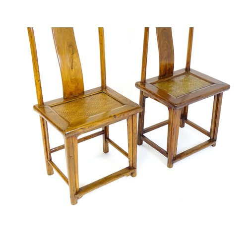 1518 - Two 19thC Chinese elm yoke back chairs, with shaped top rails, bowed mid rails and a rushed seat abo... 