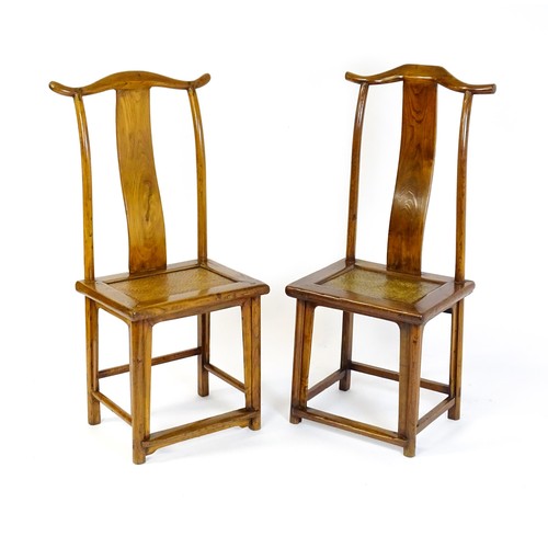 1518 - Two 19thC Chinese elm yoke back chairs, with shaped top rails, bowed mid rails and a rushed seat abo... 