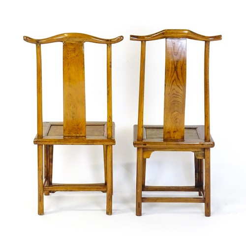 1518 - Two 19thC Chinese elm yoke back chairs, with shaped top rails, bowed mid rails and a rushed seat abo... 