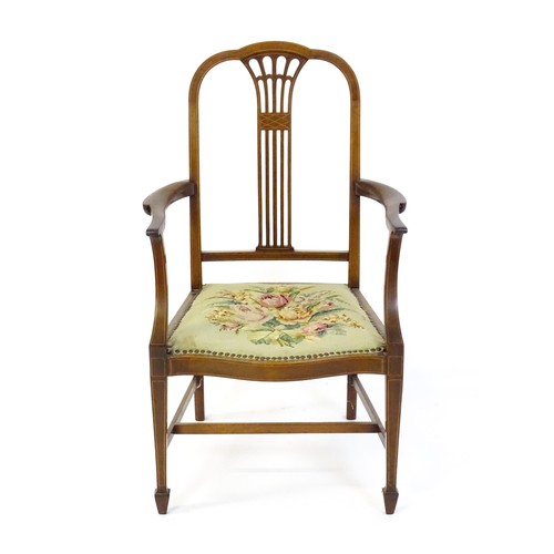 1523 - An early 20thC mahogany open armchair, with a shaped top rail, fanned and marquetry inlaid back spla... 