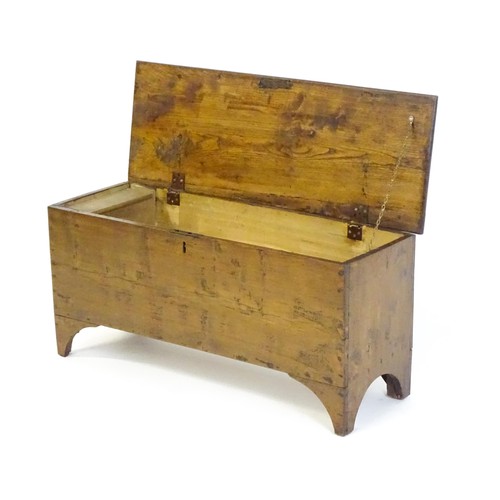 1539 - A 19thC sword chest with a hinged lid and candle box within. 37