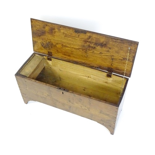 1539 - A 19thC sword chest with a hinged lid and candle box within. 37