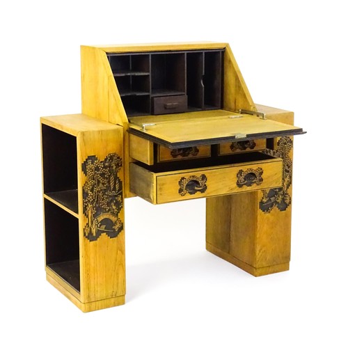 1547 - An early / mid 20thC Teak bureau accompanied by a stool, with carved oriental scenes to the front, d... 