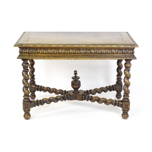 1548 - A late 19thC oak side table with a carved outer rim and single long drawer raised on barley twist le... 