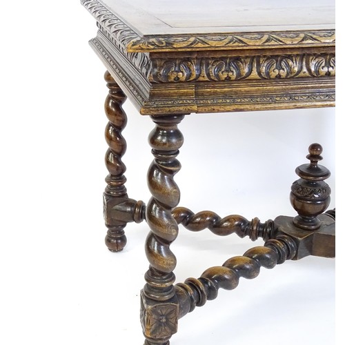 1548 - A late 19thC oak side table with a carved outer rim and single long drawer raised on barley twist le... 