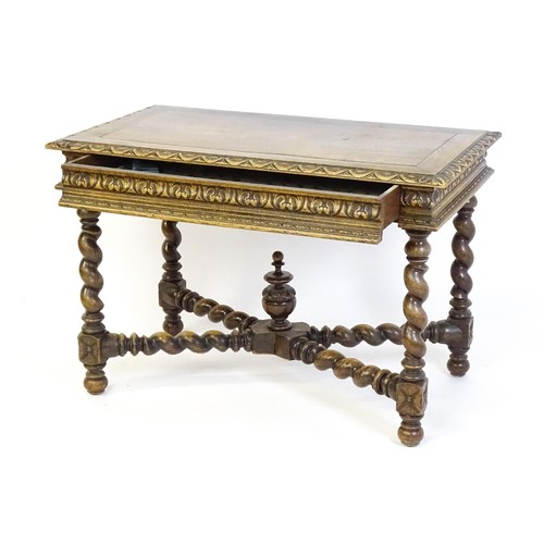 1548 - A late 19thC oak side table with a carved outer rim and single long drawer raised on barley twist le... 