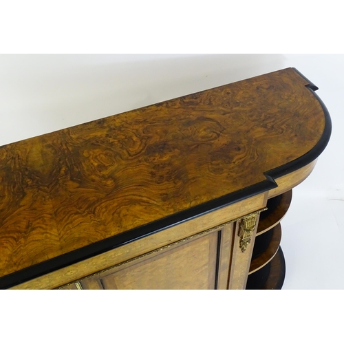 1553 - A 19thC burr walnut credenza, with an ebonised finish to the top edge and to the stepped base. The b... 