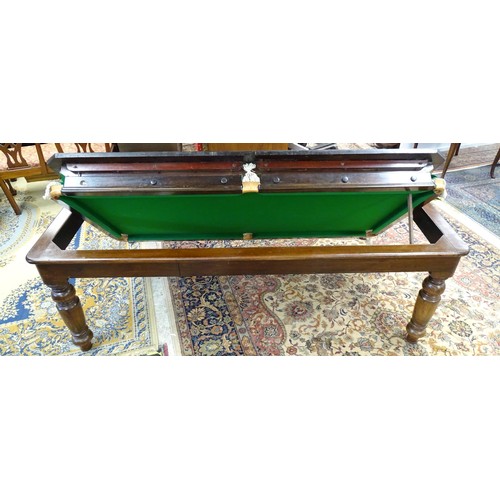 1559 - A 20thC oak combination dining / snooker table, with revolving mechanism and slate base, approx 84 1... 