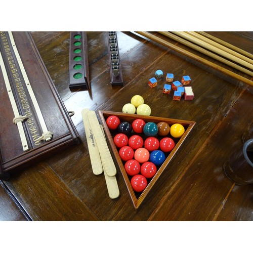 1559 - A 20thC oak combination dining / snooker table, with revolving mechanism and slate base, approx 84 1... 