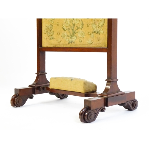 1611 - A late 19thC mahogany fire screen with a hinged shelf attached to the top of the frame, the central ... 