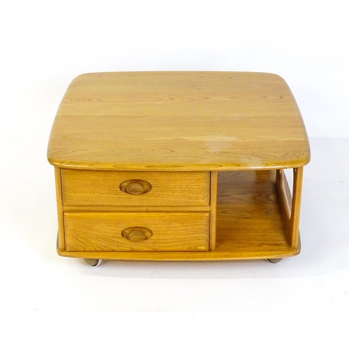 1627 - Vintage / Retro: An elm 'Pandora's box' coffee table, with pierced sides, two small drawers and an u... 