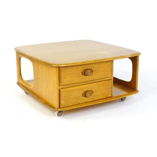 1627 - Vintage / Retro: An elm 'Pandora's box' coffee table, with pierced sides, two small drawers and an u... 