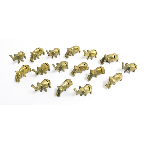 1140 - A quantity of 20thC brass novelty menu / table place card holders of elephant form. Largest approx. ... 