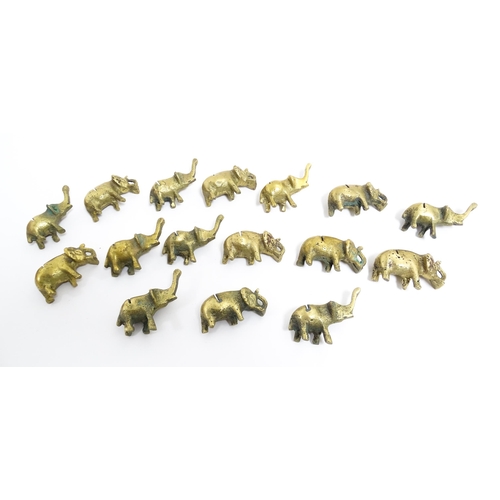 1140 - A quantity of 20thC brass novelty menu / table place card holders of elephant form. Largest approx. ... 