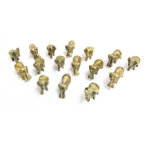 1140 - A quantity of 20thC brass novelty menu / table place card holders of elephant form. Largest approx. ... 