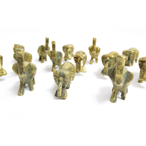 1140 - A quantity of 20thC brass novelty menu / table place card holders of elephant form. Largest approx. ... 