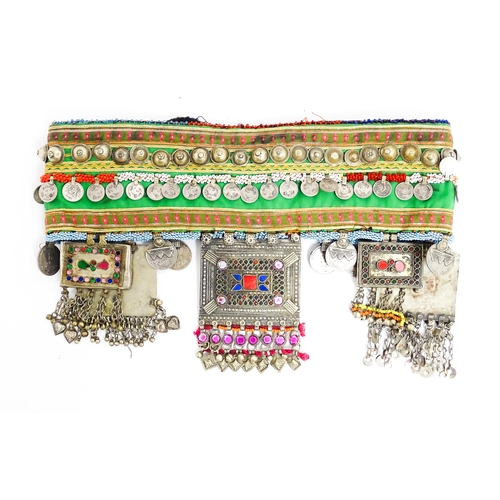 1154 - An Eastern dance belt decorated with banded stud, bead, and coin detail, with decorative plaques low... 