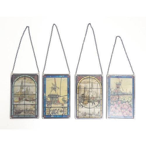 1155 - Four 20thC double glazed stained glass window style prints depicting Dutch scenes, to include tulip ... 