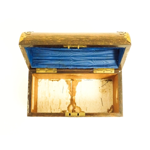 1156 - A Victorian walnut dome top caddy / casket with scrolling brass mounts. Approx. 6 1/4