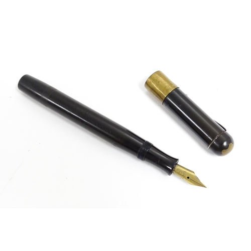 1164 - A 20thC Mont Blanc Simplo fountain pen, with 18ct gold nib, the barrel marked '25', approx 5 3/8