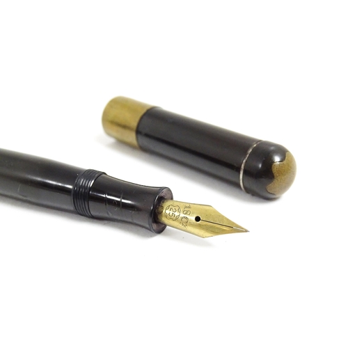 1164 - A 20thC Mont Blanc Simplo fountain pen, with 18ct gold nib, the barrel marked '25', approx 5 3/8