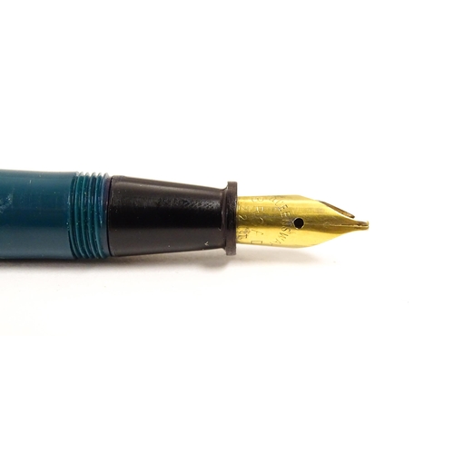 1165 - A 20thC Queensway fountain pen, in teal finish with 22ct gold nib, approx 5 1/2