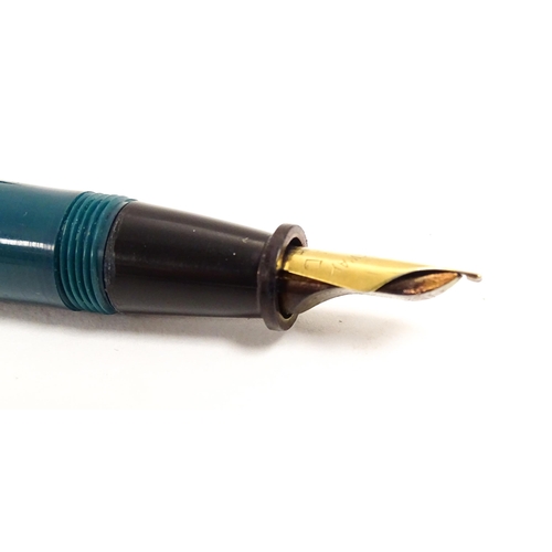 1165 - A 20thC Queensway fountain pen, in teal finish with 22ct gold nib, approx 5 1/2