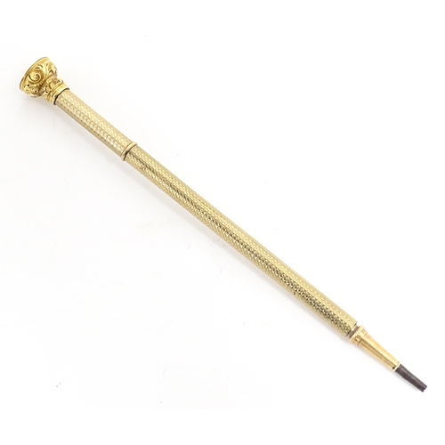 1168 - An early 20thC fountain pen with retractable nib and gilt metal detail. Together with a propelling p... 