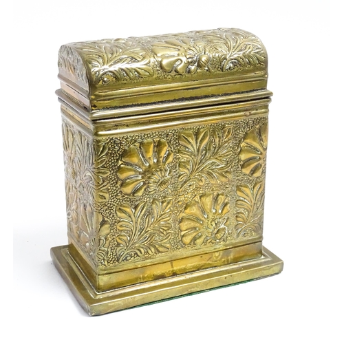 1172 - An early 20thC brass box with domed hinge lid decorated with flowers and foliage. Approx. 5 3/4