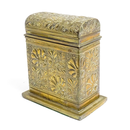 1172 - An early 20thC brass box with domed hinge lid decorated with flowers and foliage. Approx. 5 3/4