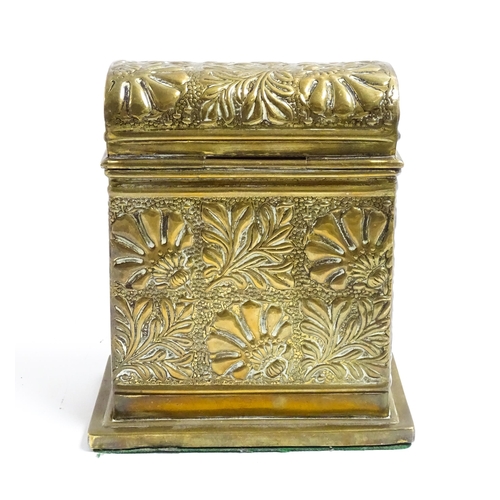 1172 - An early 20thC brass box with domed hinge lid decorated with flowers and foliage. Approx. 5 3/4