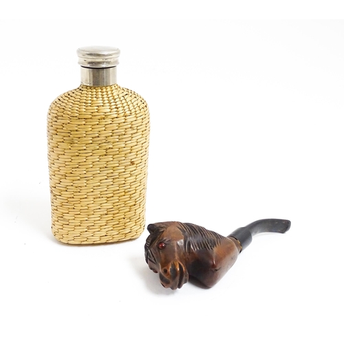 1176 - An early 20thC hip flask with rattan woven cover. Together with a carved novelty tobacco pipe, the b... 