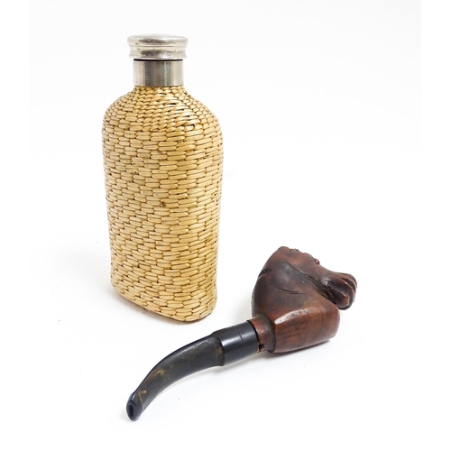 1176 - An early 20thC hip flask with rattan woven cover. Together with a carved novelty tobacco pipe, the b... 