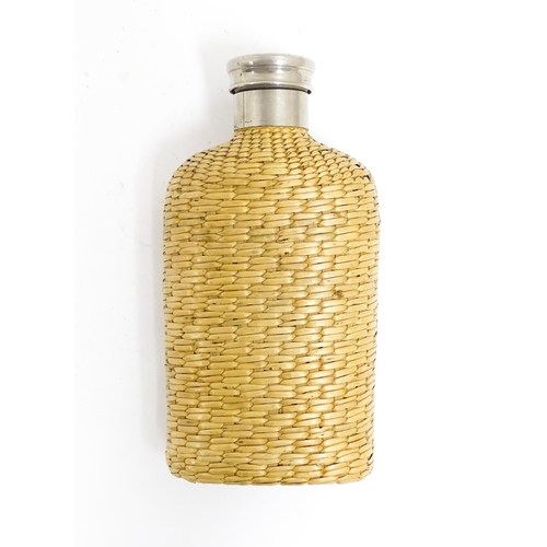 1176 - An early 20thC hip flask with rattan woven cover. Together with a carved novelty tobacco pipe, the b... 