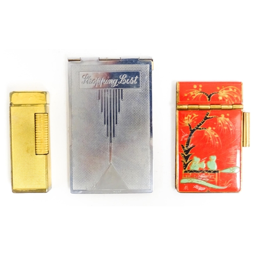 1177 - A Dunhill Rollagas lighter with chequered finish. Together with an Oriental enamelled aide de memoir... 