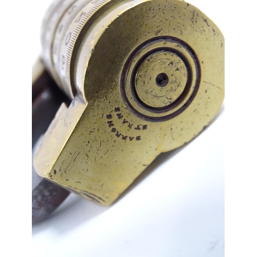 1180 - A Victorian brass letter combination padlock. Stamped Barron's Strand. Unlock code 'JOKE'. Approx. 2... 