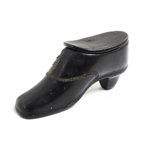 1185 - A late 19th / early 20thC lacquered papier mache snuff box modelled as a shoe. Approx. 3 1/4