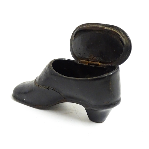 1185 - A late 19th / early 20thC lacquered papier mache snuff box modelled as a shoe. Approx. 3 1/4