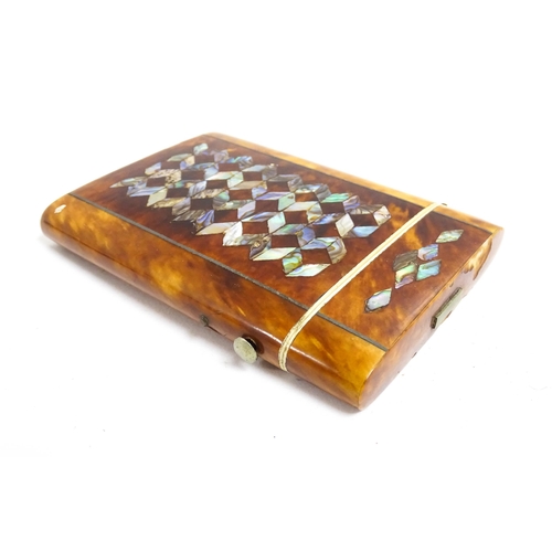 1187 - A Victorian tortoiseshell card case of rectangular form with inlaid abalone geometric decoration. Ap... 