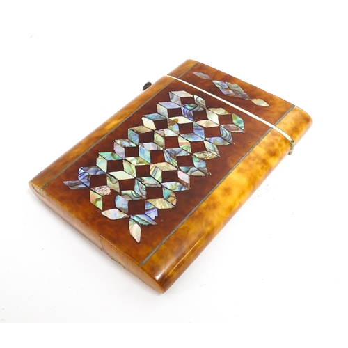 1187 - A Victorian tortoiseshell card case of rectangular form with inlaid abalone geometric decoration. Ap... 