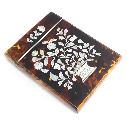 1188 - A Victorian tortoiseshell card case of rectangular form with inlaid mother of pearl floral and folia... 