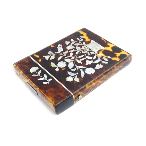 1188 - A Victorian tortoiseshell card case of rectangular form with inlaid mother of pearl floral and folia... 