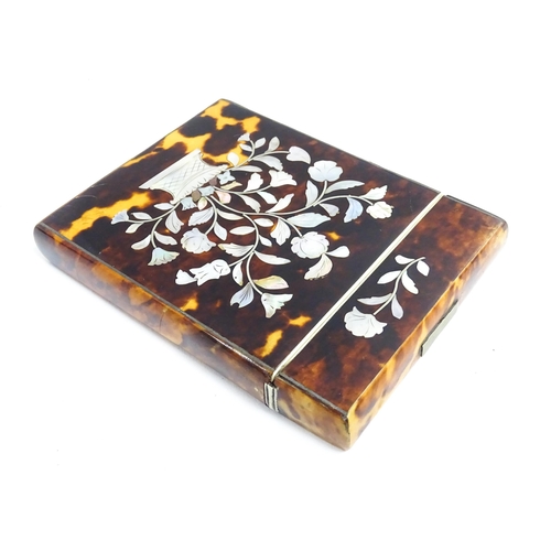 1188 - A Victorian tortoiseshell card case of rectangular form with inlaid mother of pearl floral and folia... 