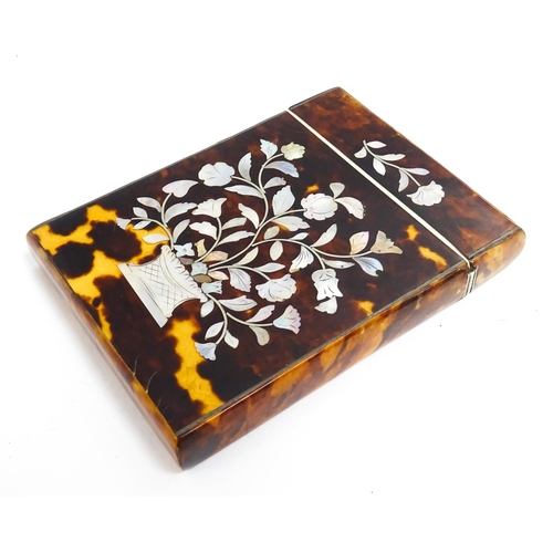 1188 - A Victorian tortoiseshell card case of rectangular form with inlaid mother of pearl floral and folia... 