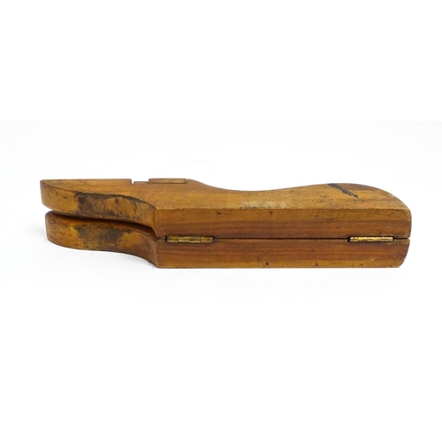 1192 - An early 20thC folding boot jack opening to reveal a pair of steel boot / button hook tools. Approx.... 